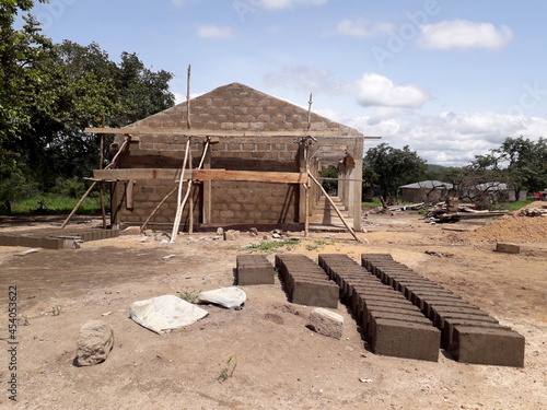 school building under construction in an undeveloped country in Africa. Developing countries and relief work context. School for african children.