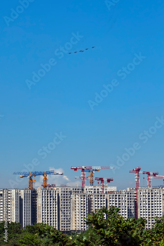 fighter jets flying over construction site