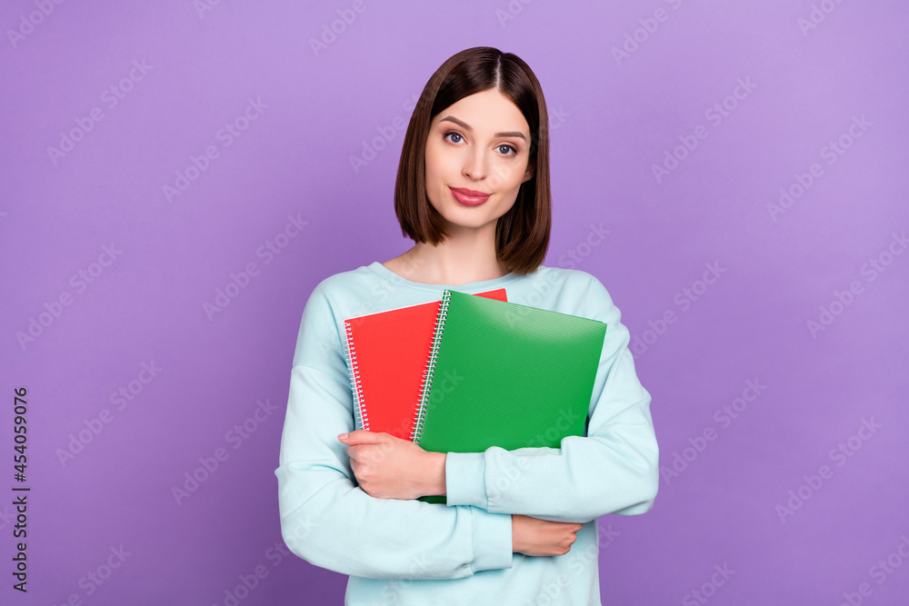 Photo portrait girl keeping book preparing to test isolated pastel purple color background Photo portrait girl keeping book preparing to test isolated pastel purple color background