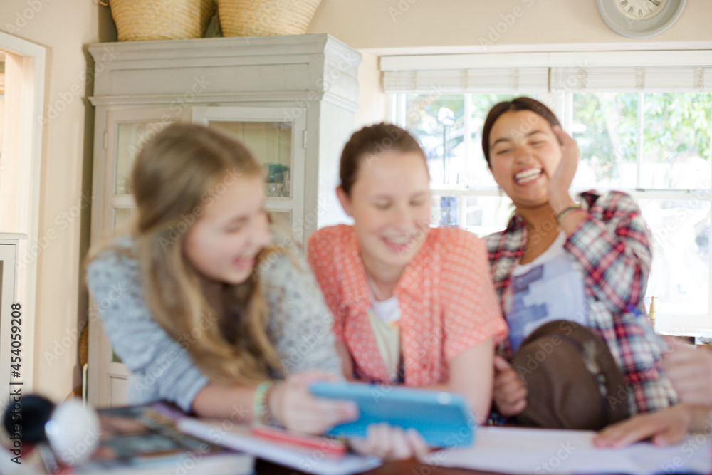 Group of smiling teenagers taking selfie in dining room Group of smiling teenagers taking selfie in dining room