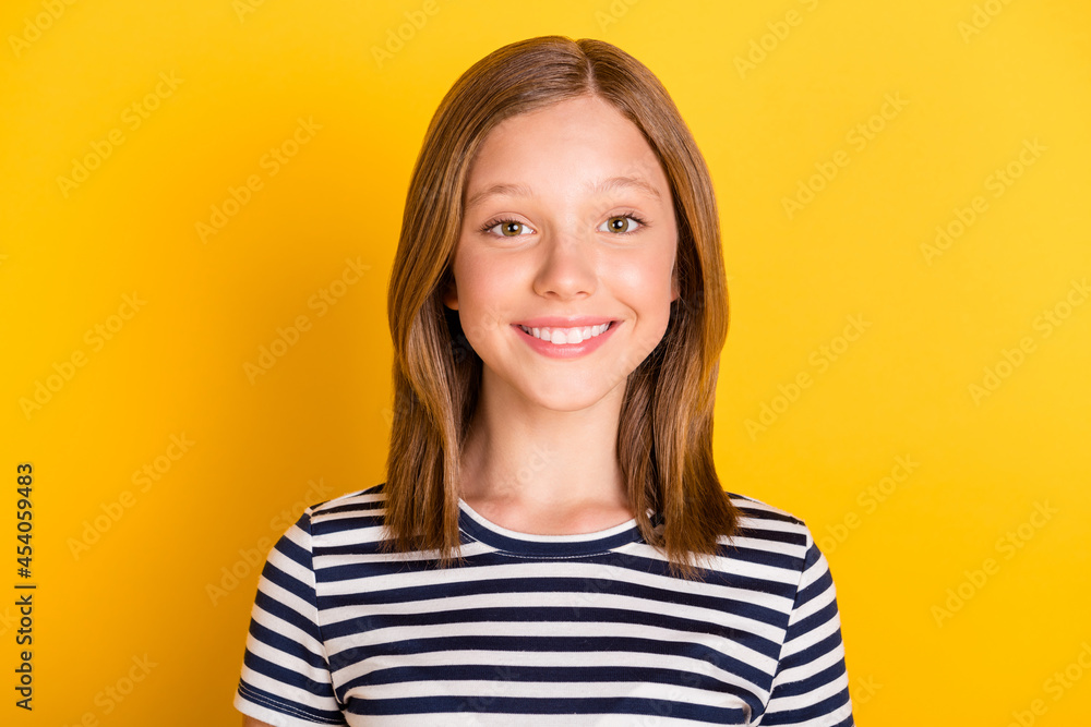 Portrait of charming young girl beaming smile look camera isolated on bright yellow color background Portrait of charming young girl beaming smile look camera isolated on bright yellow color background