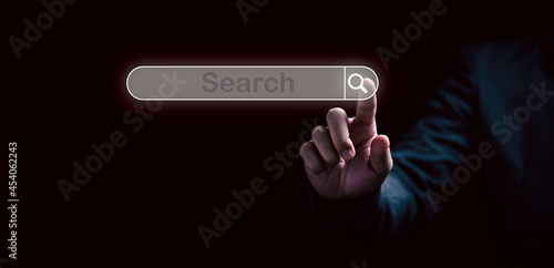 Man hand touching to virtual screening searching icon for Web search engine concept.