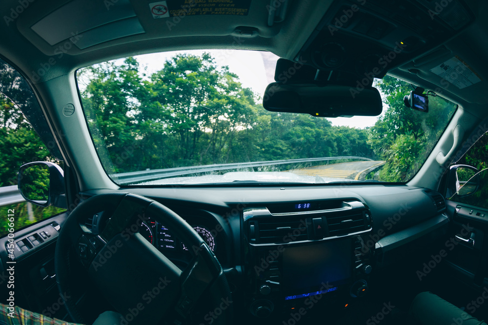 Fototapeta premium People driving car on mountain road