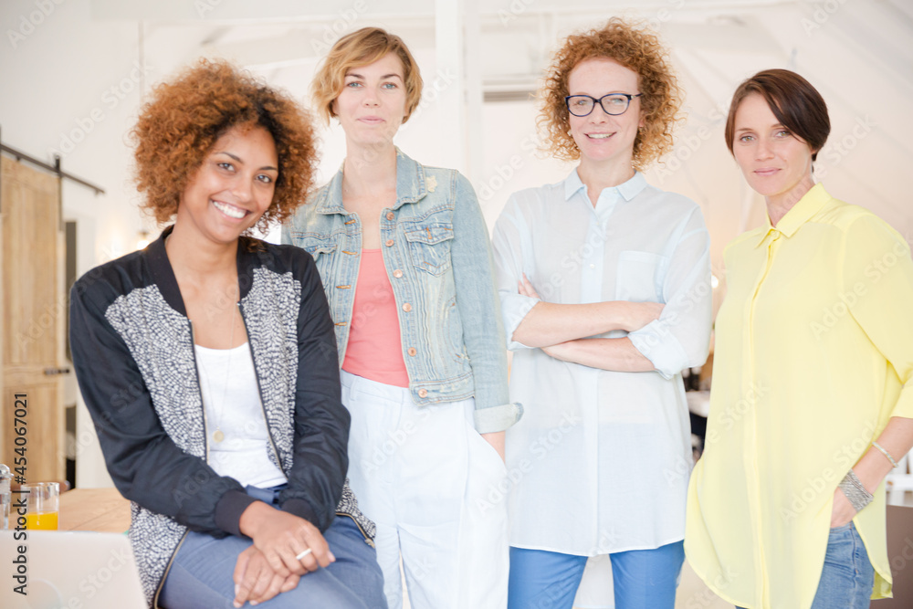 Group of smiling women at work Group of smiling women at work