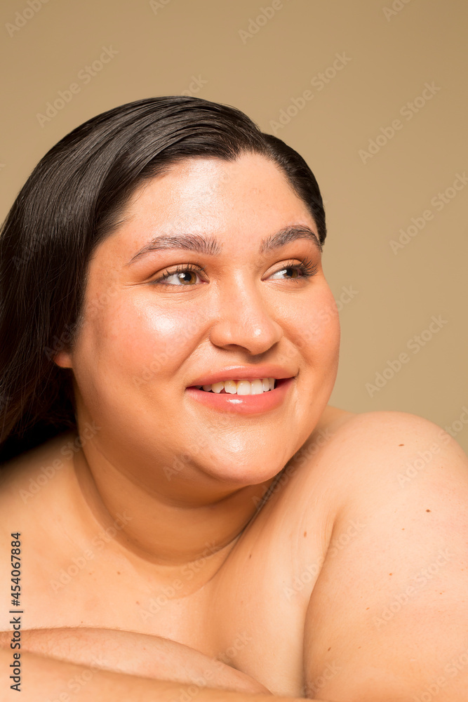 Studio portrait of young shirtless woman, headshot Studio portrait of young shirtless woman, headshot
