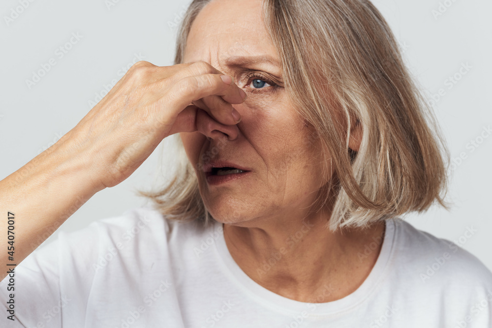 elderly woman in white t-shirt pain health problems dissatisfaction treatment elderly woman in white t-shirt pain health problems dissatisfaction treatment