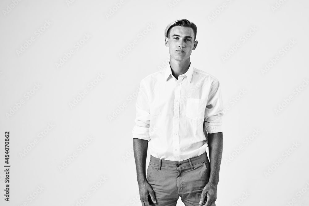 Fototapeta premium man in white shirt fashionable hairstyle posing studio cropped view