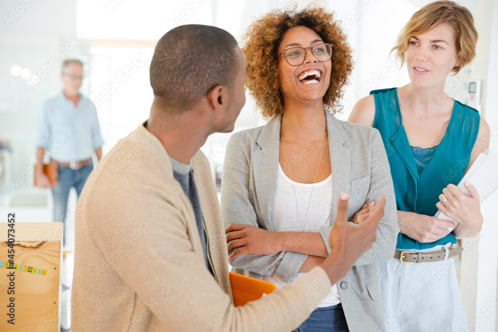 Fototapeta premium Portrait of talking and smiling office workers