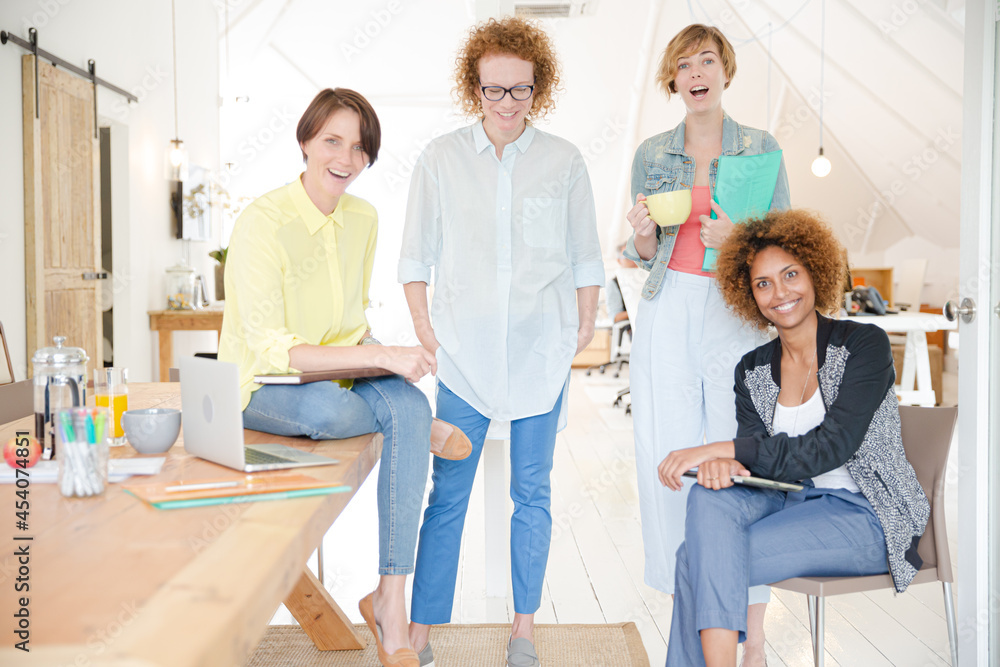 Group of smiling women at work Group of smiling women at work