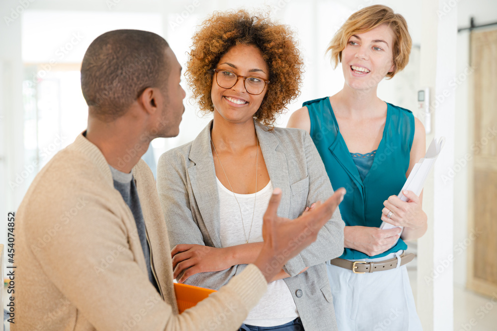 Fototapeta premium Portrait of talking and smiling office workers