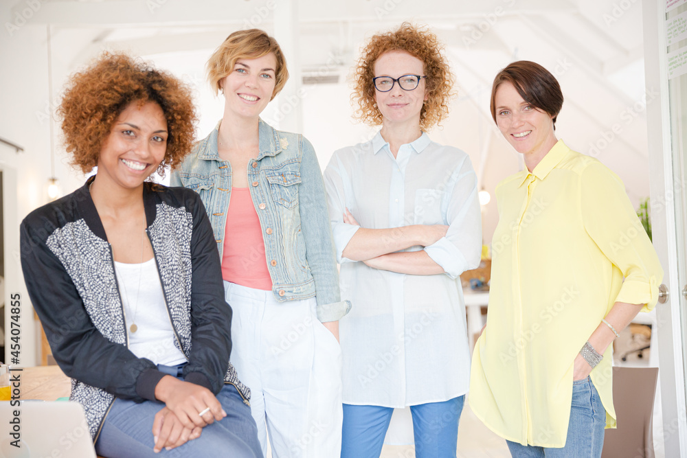Group of smiling women at work Group of smiling women at work