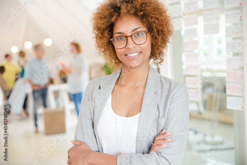 Portrait of young woman smiling at office