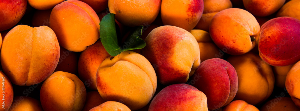 Close-up of fresh.Space for text top view. A group of ripe peaches on dark kitchen table. Close-up of fresh.Space for text top view. A group of ripe peaches on dark kitchen table.