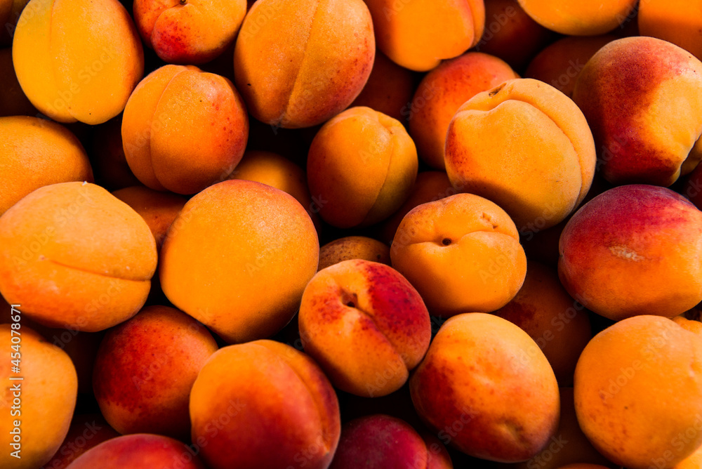 Close-up of fresh.Space for text top view. A group of ripe peaches on dark kitchen table. Close-up of fresh.Space for text top view. A group of ripe peaches on dark kitchen table.