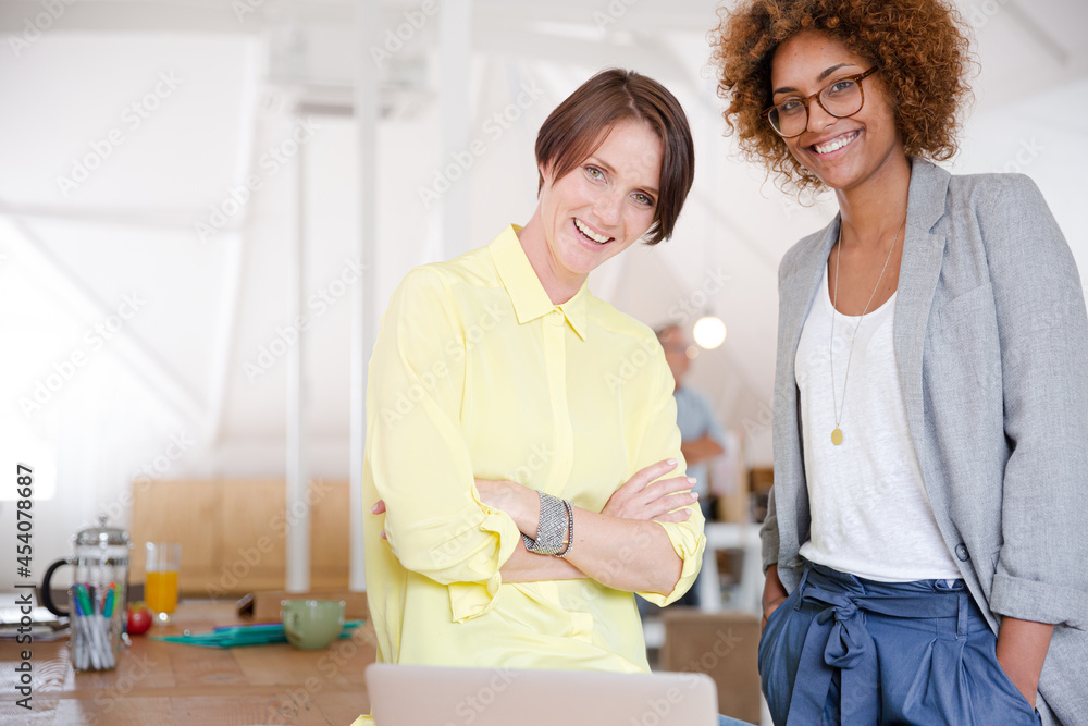 Portrait of two smiling office workers Portrait of two smiling office workers
