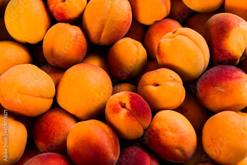 Close-up of fresh.Space for text top view. A group of ripe peaches on dark kitchen table.