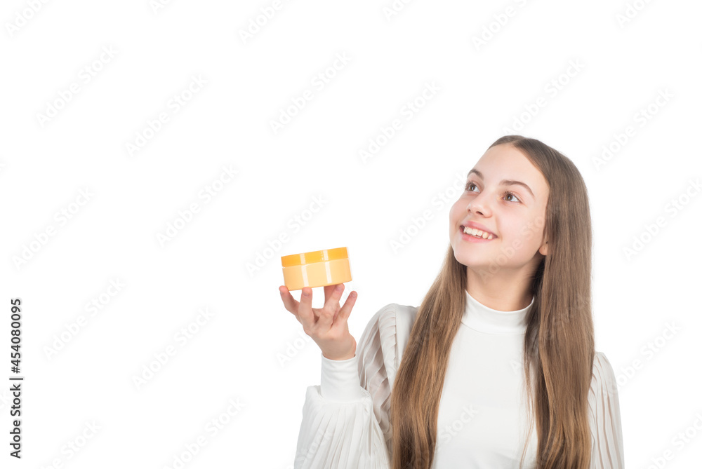 happy child presenting beauty cosmetic product of facial skin cream, moisturizing cream. happy child presenting beauty cosmetic product of facial skin cream, moisturizing cream.