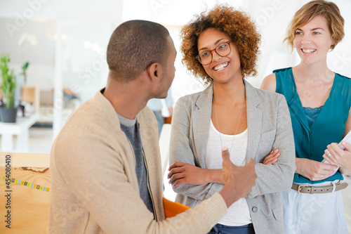 Portrait of talking and smiling office workers