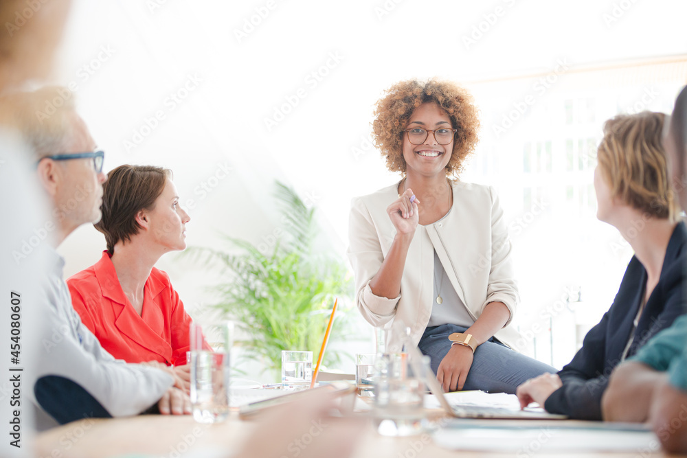 Office workers talking at desk Office workers talking at desk