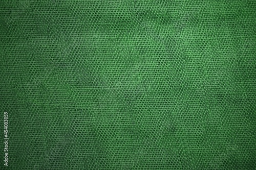 Rustikaler Hintergrund aus Stoff in grün