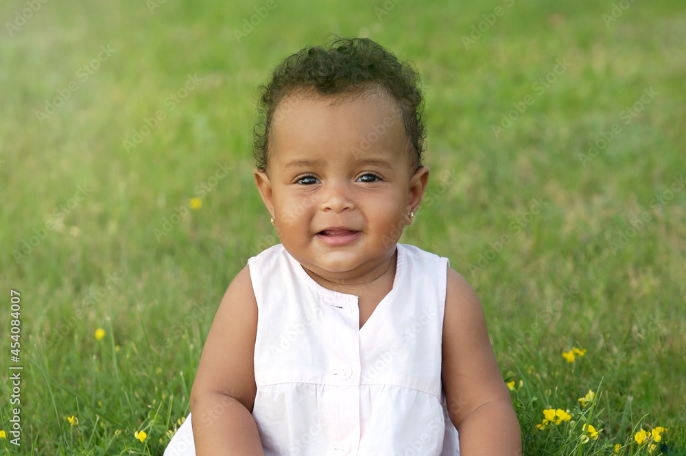 Cute little dark skinned, mix race African baby girl smiling Cute little dark skinned, mix race African baby girl smiling