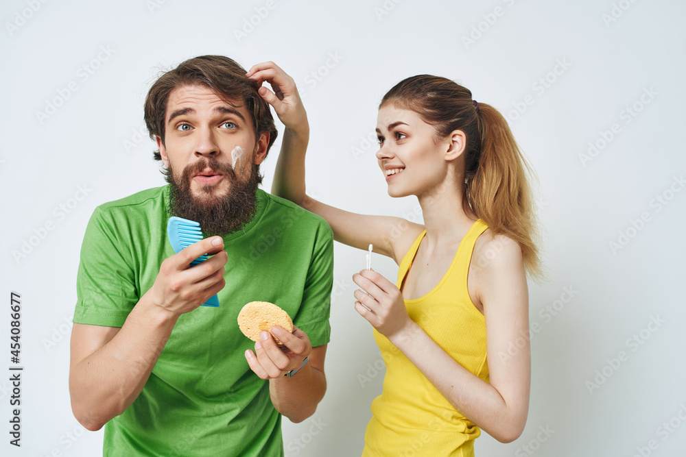 man and woman in the bathroom facial morning hygiene man and woman in the bathroom facial morning hygiene