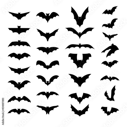 Set of black silhouettes of bats isolated on white background. Collection of flittermouse icons. Tattoo of bat vampire. Scary Halloween traditional design element. Vector illustration.