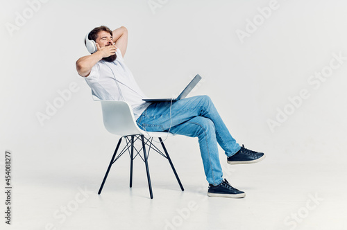 bearded man listening to music on headphones entertainment © SHOTPRIME STUDIO