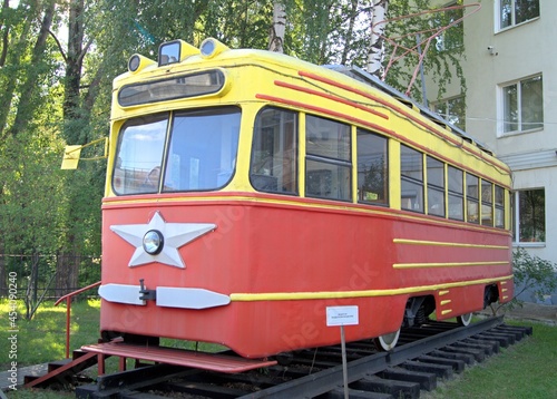An old soviet tram. Red-yellow Soviet tram. 