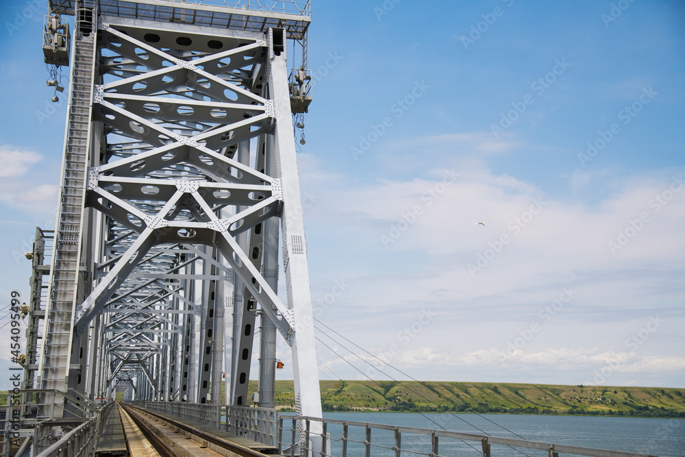 Large metal railway bridge across the river