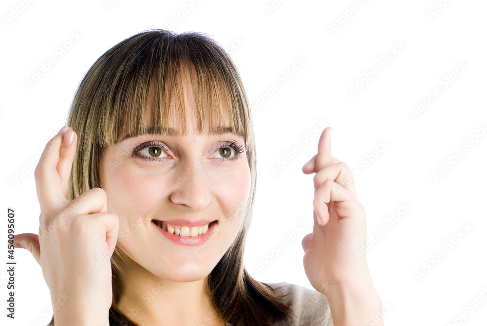 Young attractive woman with fingers crossed over white background Young attractive woman with fingers crossed over white background
