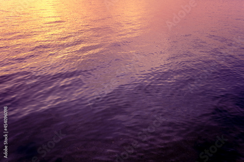 Top view of seawater at sunset. Abstract nature landscape background. Gradient color