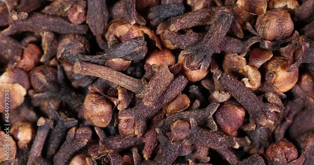 Fragrant dry clove but spice macro closeup top view pileup rotate flow slide Fragrant dry clove but spice macro closeup top view pileup rotate flow slide