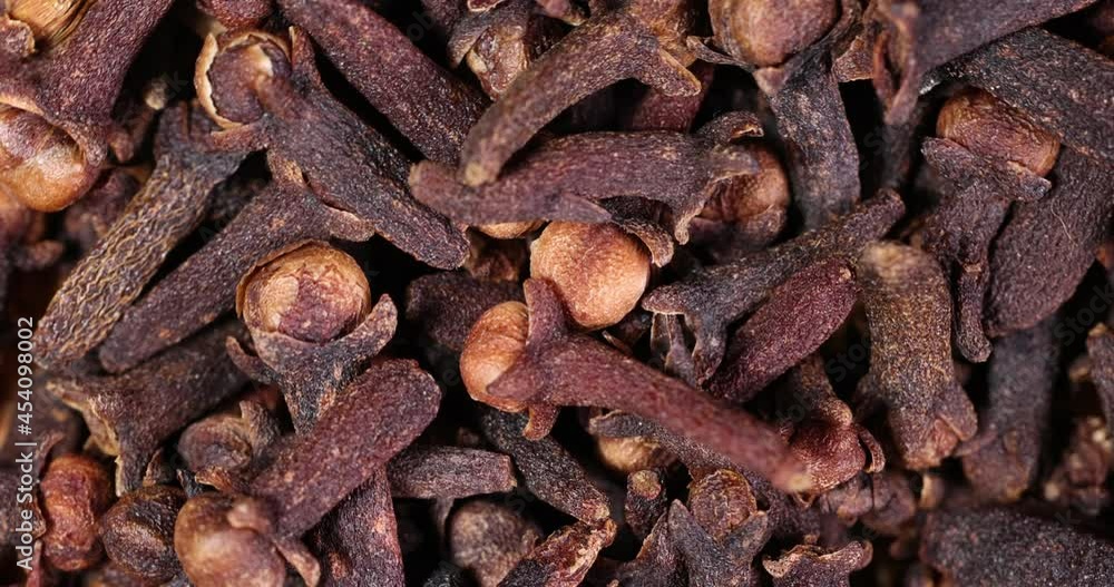Fragrant dry clove but spice macro closeup top view pileup rotate flow slide Fragrant dry clove but spice macro closeup top view pileup rotate flow slide