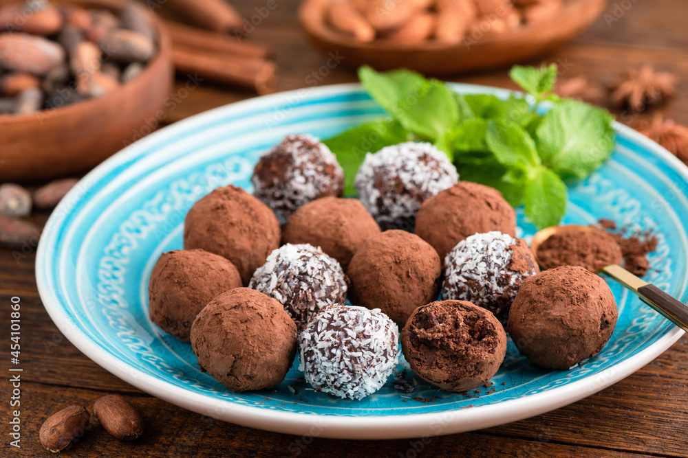 Homemade vegan coconut chocolate truffles, closeup view. Sweet food Homemade vegan coconut chocolate truffles, closeup view. Sweet food