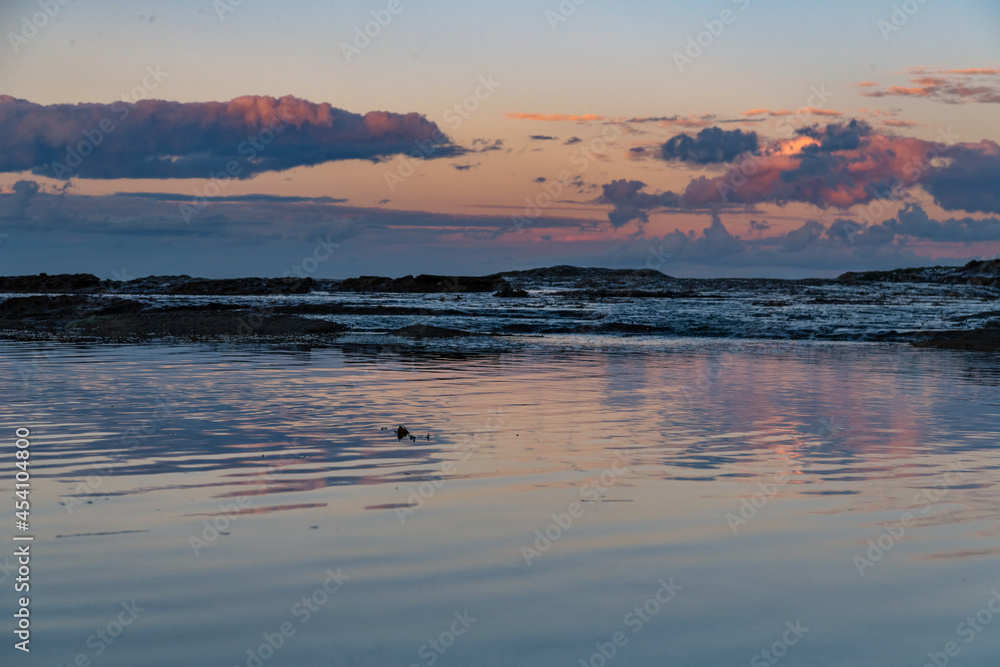 Sunset reflections in rock pool