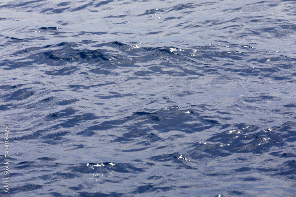 Sea background with waves, reflections and copy space. Sea background with waves, reflections and copy space.