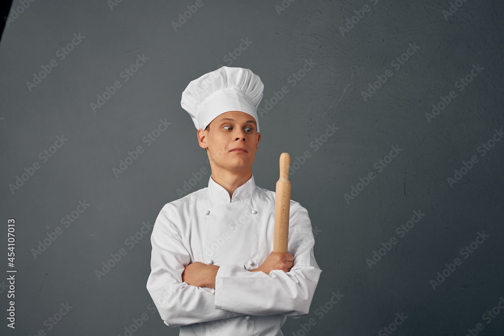 man in chef's uniform frying pan in hands cooking food isolated background man in chef's uniform frying pan in hands cooking food isolated background