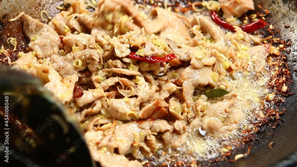 Fried chopped pork with chopped lemon grass and kaffir leaves in pan , Thai famous food Fried chopped pork with chopped lemon grass and kaffir leaves in pan , Thai famous food