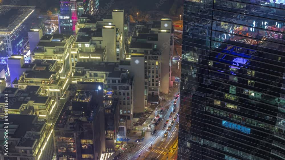 Hotels and office buildings in financial district in Dubai aerial night timelapse Hotels and office buildings in financial district in Dubai aerial night timelapse