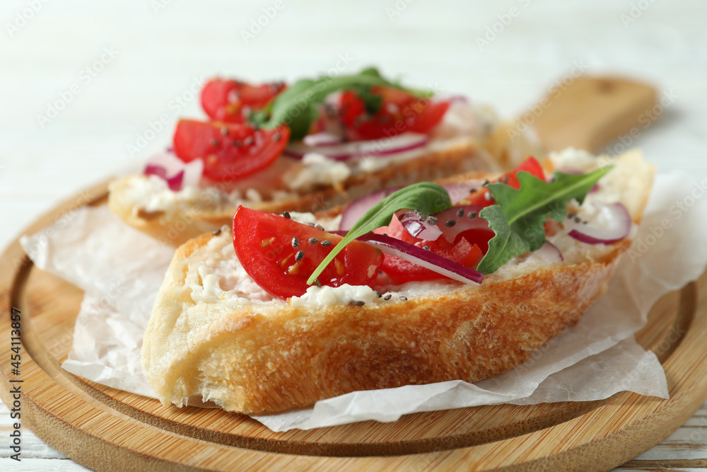 Concept of tasty food with bruschetta snacks on white wooden table