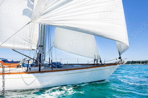 luxury wood yacht sailing under wind 
