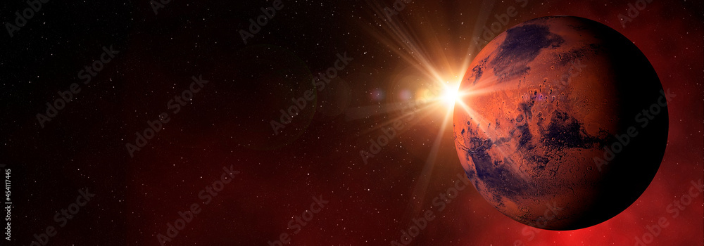 Fototapeta premium Sunlight over the planet Mars in the red starry outer space