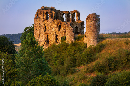 Sun setting on the ruins of Clun castle Shropshire Hills, West Midlands photo