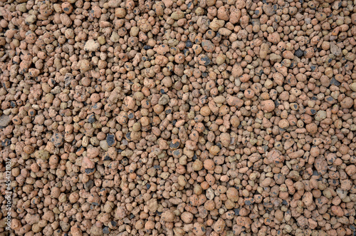 Lightweight expanded clay aggregate or expanded clay is a lightweight aggregate made by heating clay to around 1,200 °C in a rotary kiln. The yielding gases expand clay by thousands small bubbles