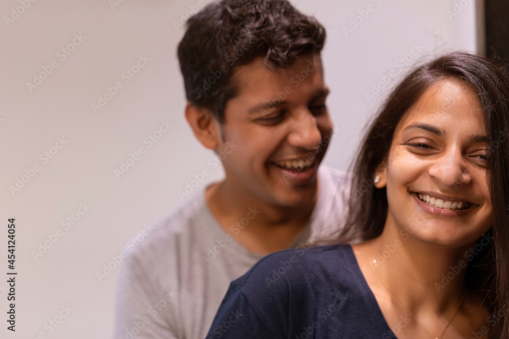 Young couple smiling spending quality-time together. Young couple smiling spending quality-time together.