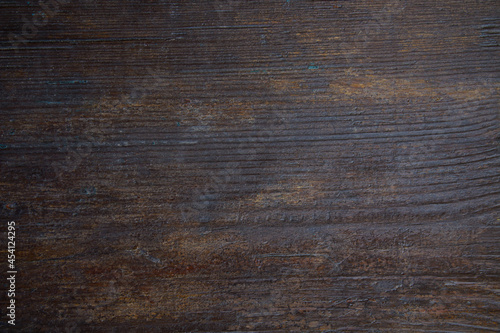 Old painted brown wooden board. Close-up. Horizontal view. Background. Texture.