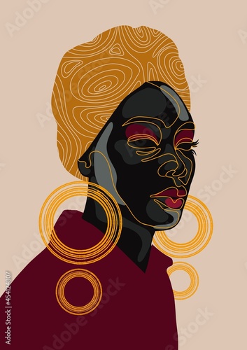 Woman wearing turban and hoop earrings photo