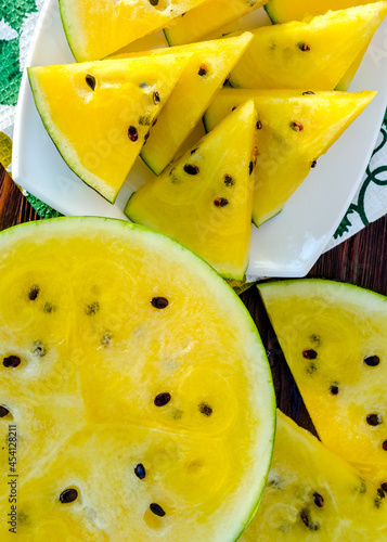 atermelon with yellow pulp on the table photo