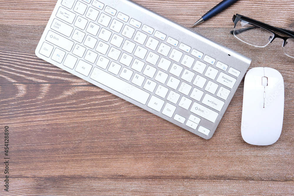 Office equipment, keyboard on table background and top view working space office Office equipment, keyboard on table background and top view working space office